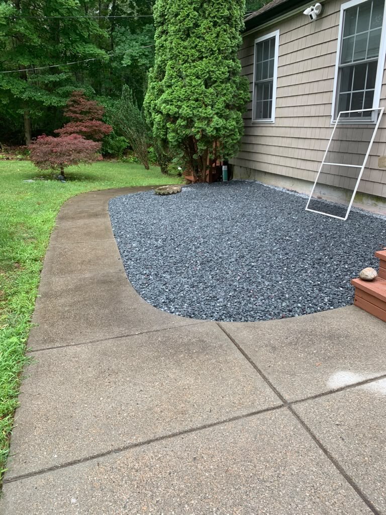Paver walkway leading to a residential porch