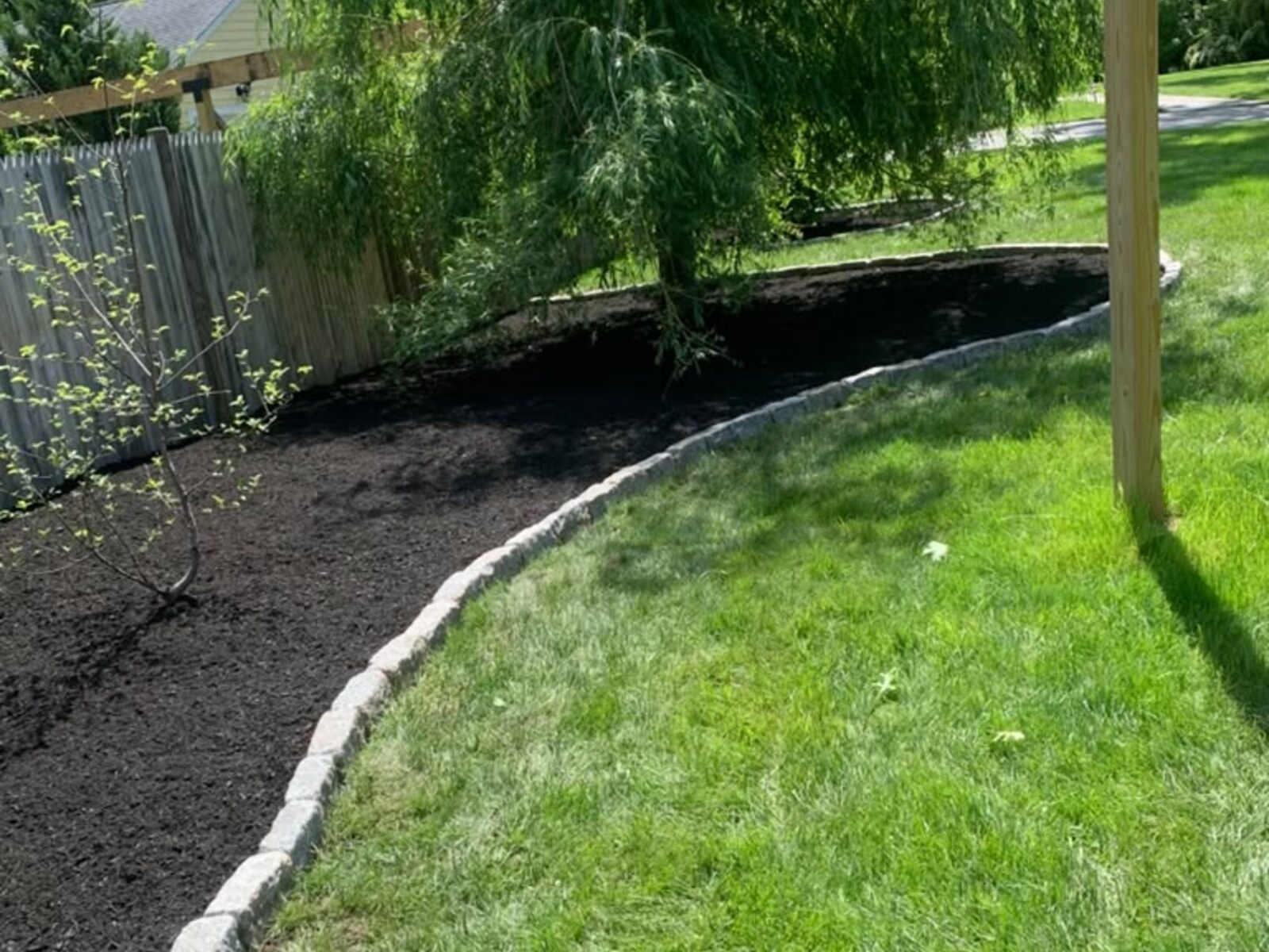 Freshly laid mulch in a landscaped planting bed